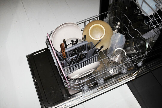 Close-up of modern technology tech dishwasher machine with flashlight