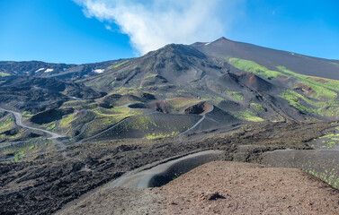 Panoramic view of Mount Etna's summit crater and volcanic slopes above Silvestri Craters, © afinocchiaro