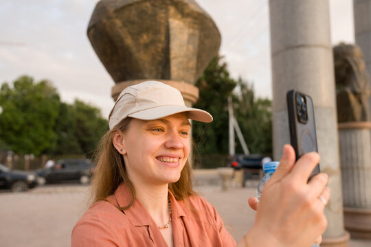 Happy Tourist Using Phone In Khujand, Tajikistan