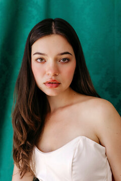 Beautiful woman portrait against green backdrop