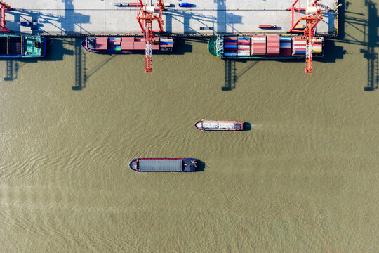 cargo port with cranes loading container ships