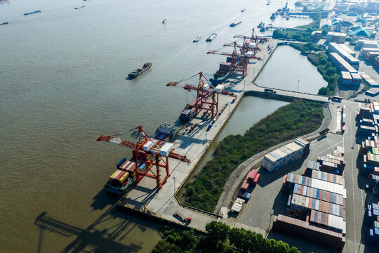 cargo port with cranes loading container ships