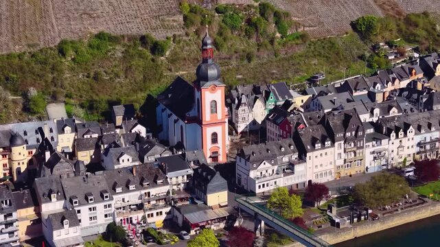 Aerial view of the city and old town above Zell beside the river Mosel in Germany on a sunny spring day
