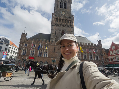 UGC Style Selfie of Smiling Woman Tourist in Bruges Belgium