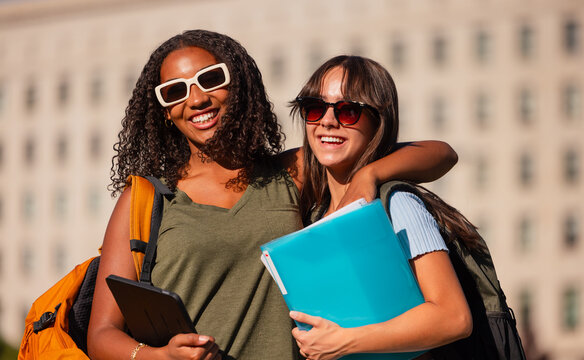 Teenage girls with backpacks and school accessories