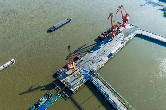 cargo port with cranes loading container ships