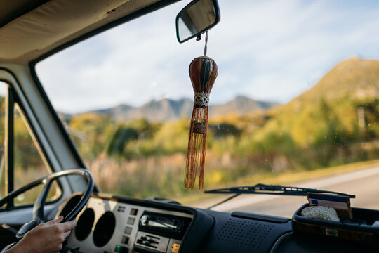 Road trip driving van life with mountain view