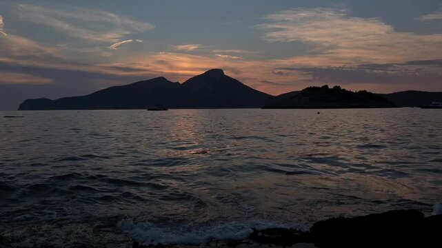 Sa Dragonera island silhouette at sunset with natural sea ambience, Mallorca