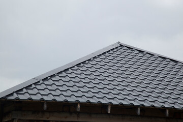 Fototapeta premium Metal tile.Roof for the house. Modern coatings for the roof of the house.