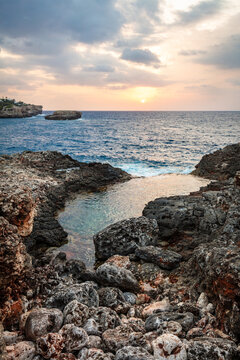 Soft focus sunset coast in scenic Cala d'Or, Mallorca, Spain.