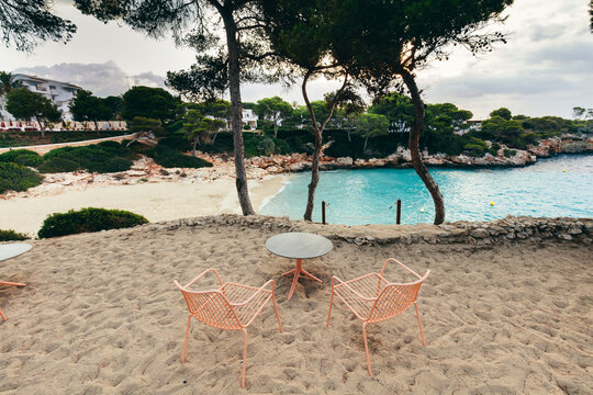 Quiet Cala Esmeralda beach seating in Cala d'Or, Mallorca, Spain.