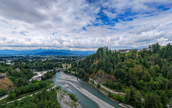 Aerial View of Winding River and Forested Hills Overlooking Chilliwack in Fraser Valley, British Columbia