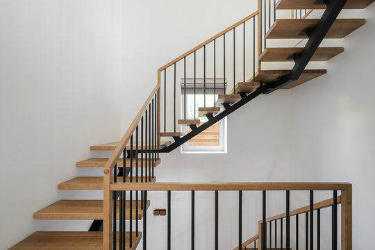 Contemporary wooden staircase in house