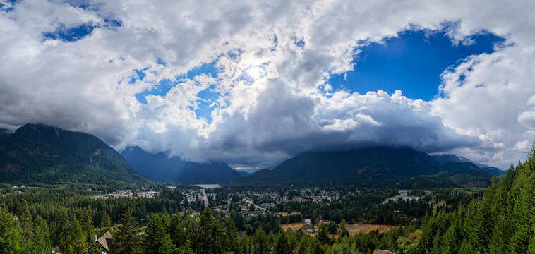 Dramatic Mountain Clouds Over Small Town Valley in Hope British Columbia Canada Panorama