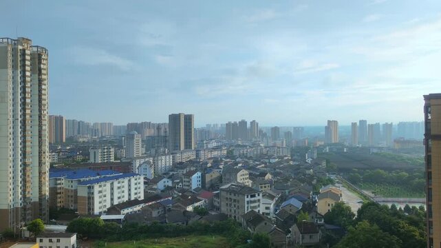 Aerial view of mixed urban residential buildings under cloudy sky, city skyline landscape