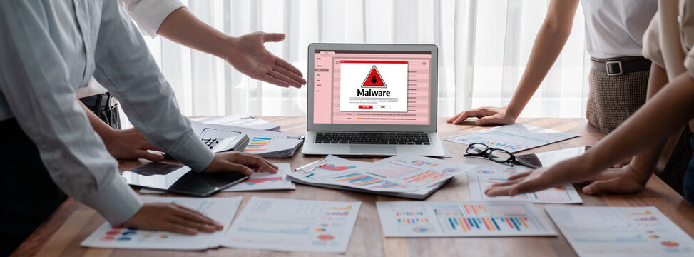 Cyber attacking concept. Malware alert showing on computer screen display scam and threat detection on computer system or online server to be removed brisk.