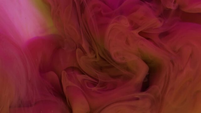Acrylic smog. Ink flow. Blur yellow pink colorful cloud splash bright underwater acrylic pigment spreading on abstract background.