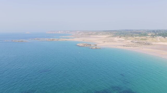 Aerial view of the sandy Anse du Croc beach and rugged coastline at Frehel, Brittany, France.