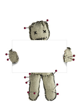 Homemade voodoo doll holding white board with copy space mockup on isolated background. Magic toy for Halloween ritual, spells, revenge