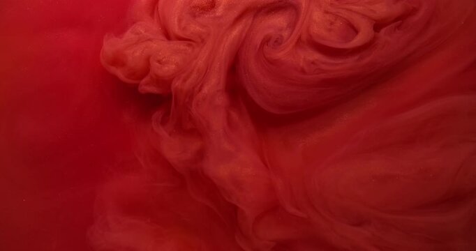Chemistry dye flow. Paint vapor. Glossy spiral swirl red cloud vortex color water. Art bright sparkling fluid blend defocused background.