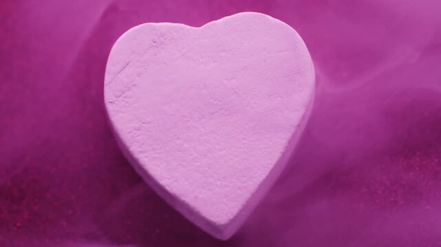 Rock heart. Smog art. Defocused neon pink purple color glitter affection texture steam fog geometric love smoke on abstract background.