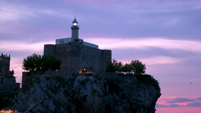 Lighthouse of the Castillo de Santa Ana in the coastal city of Castro Urdiales in the Eastern Coast region of the Autonomous Community of Cantabria, Spain, Europe