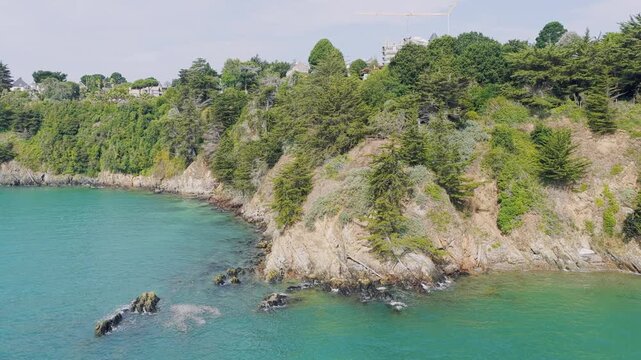 Aerial view of the rugged coastal cliffs of Binic along the Emerald Coast in Brittany, France.