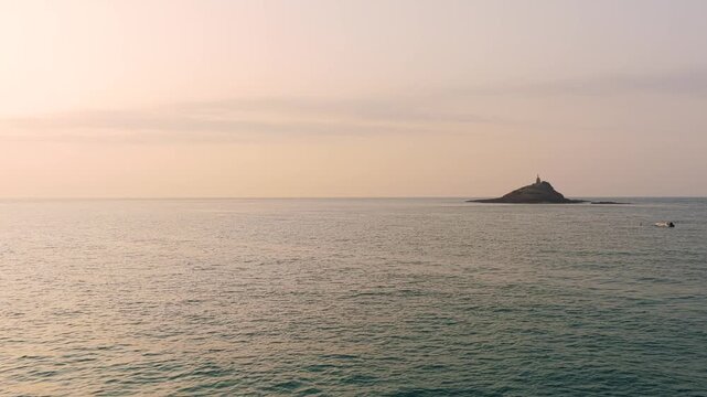 Wide shot of the Ilot Saint Michel with its iconic chapel, located off the coast of Erquy in Brittany, France.