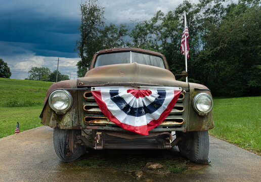 Old truck with flags and bunting in rural central Virginia