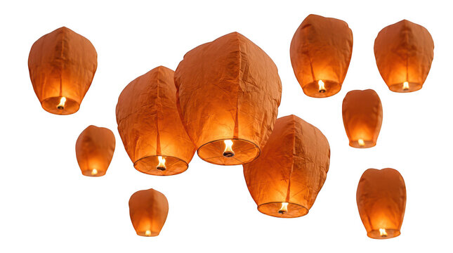 Group of orange floating sky lanterns with glowing flames isolated on transparent background