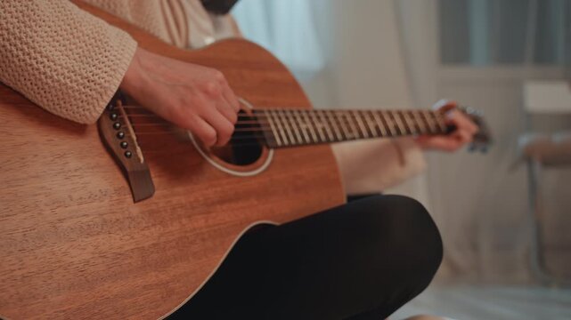 White woman hands on acoustic guitar, closeup fingerstyle technique demonstration on fretboard, precise pluck and chord transitions, tactile warm wood texture, tutorial atmosphere