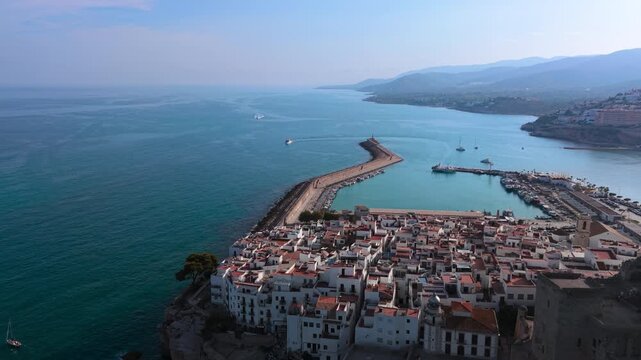 Aerial view of Peniscola castle and port, Mediterranean sea, Castellon, Spain. High quality 4k footage
