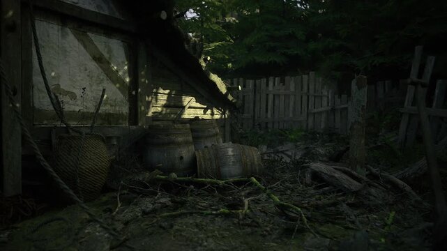 Sundappled barrels in overgrown farmyard with rickety fence and low golden light, scattered leaves and mossy ground create quiet pastoral decay in remote