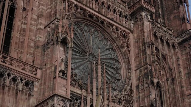 Detailed view of the intricate stone carvings and rose window of the Cathedrale Notre Dame de Strasbourg