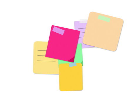 Colorful sticky notes and paper memos arranged in a messy pile for office work and reminders
