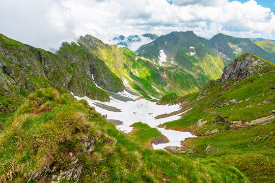 romania mountain landscape in summer. travel background of alpine scenery in fagaras mountain ridge. european summer outdoor adventures