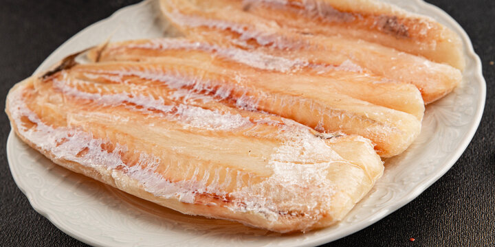 Frozen fish seafood&nbsp;white fish fillet pescetarian diet tasty snack fresh and delicious gourmet food background on the table rustic food top view copy space keto and paleo diet