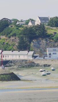 A coastal scene at low tide in Binic Port, Brittany, France.