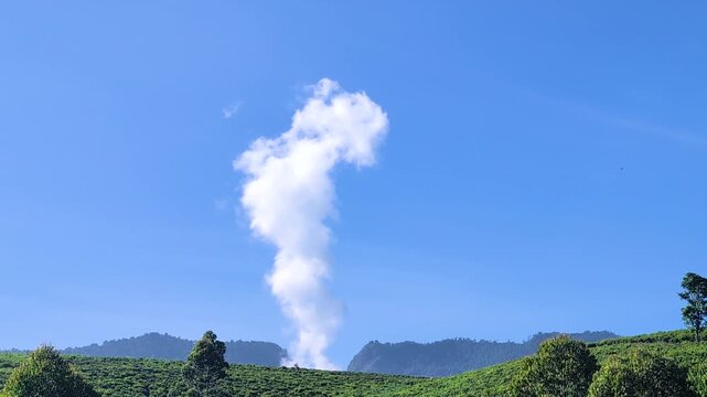 Geothermal power plant with steam plume rising above green volcanic landscape concept for renewable energy generation, sustainable electricity production, and alternative power technology.