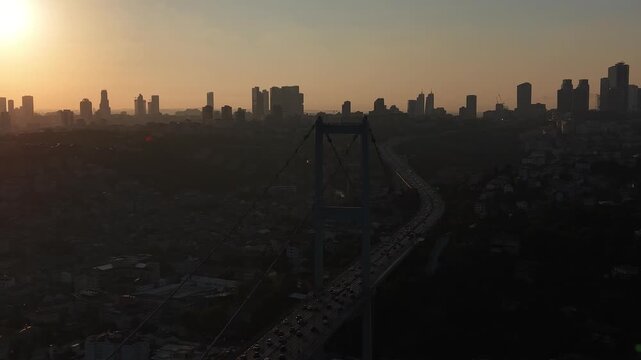 Cinematic Aerial View of Istanbul at Sunset, 15 July Martyrs Bridge and B&uuml;y&uuml;k Mecidiye Mosque with City Skyline