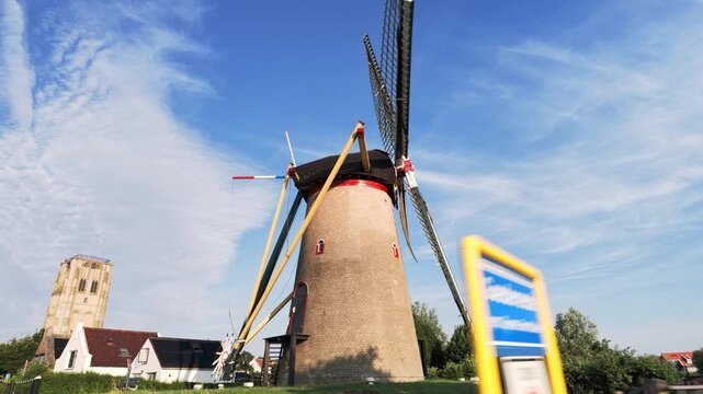 Cyclist riding through a charming Dutch village street
