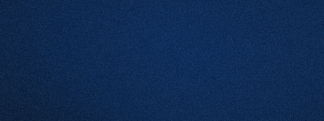 Fototapeta premium Deep blue textured surface dominates the frame. Uniform grain gives subtle depth and tactile richness. Ideal for minimalist design or abstract backgrounds