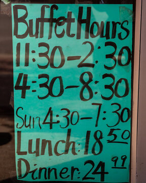 Buffet hours of operation sign.