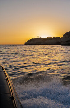 Sailing along the coast of Algarve at sunset, Portugal