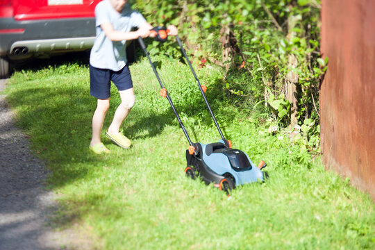 boy with a lawnmower
