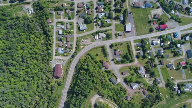 Aerial landscape footage showcases Matapedia at the confluence of the Matapedia and Restigouche rivers, highlighting the area's natural beauty and salmon fishing heritage.