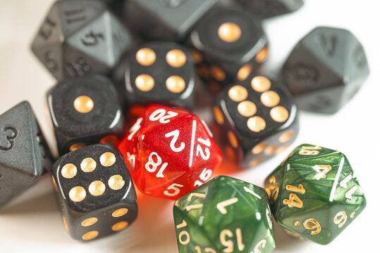 Collection of polyhedral rpg dice on white surface The Concept of gaming and strategy
