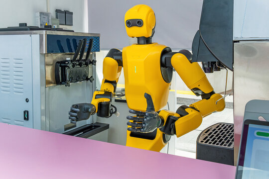 Humanoid robot preparing and serving cold drink at automated beverage station in Shenzhen, China. Artificial intelligence, robotics, service automation, autonomous machines and future food preparation