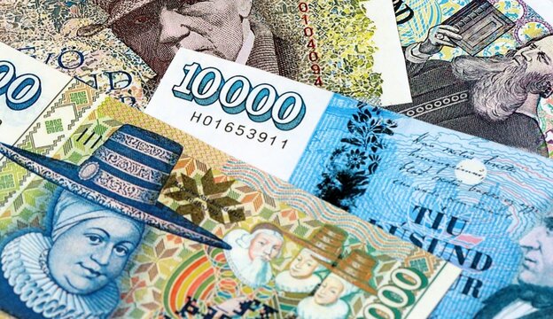 Icelandic krona money bills in pile on table. Iceland ISK currency cash close up