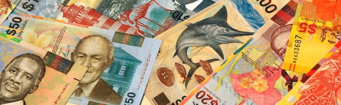 Bahamian dollar money bills in pile on table. Bahamas BSD currency cash close up